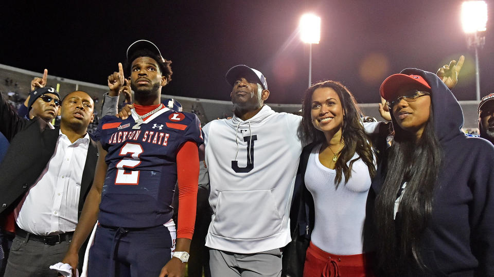 JACKSON, MISSISSIPPI – DECEMBER 03: Shedeur Sanders #2 and head coach Deion Sanders of the Jackson State Tigers pose for photos after the game against the Southern University Jaguars. Photo by Justin Ford/Getty Images.