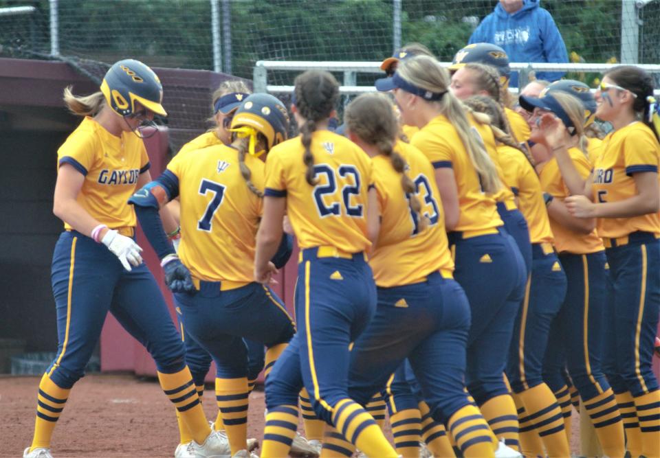 Gaylord celebrates Aubrey Jones's clutch home run during an MHSAA Division 2 softball state quarterfinal matchup between Gaylord and Hudsonville Unity Christian last season.