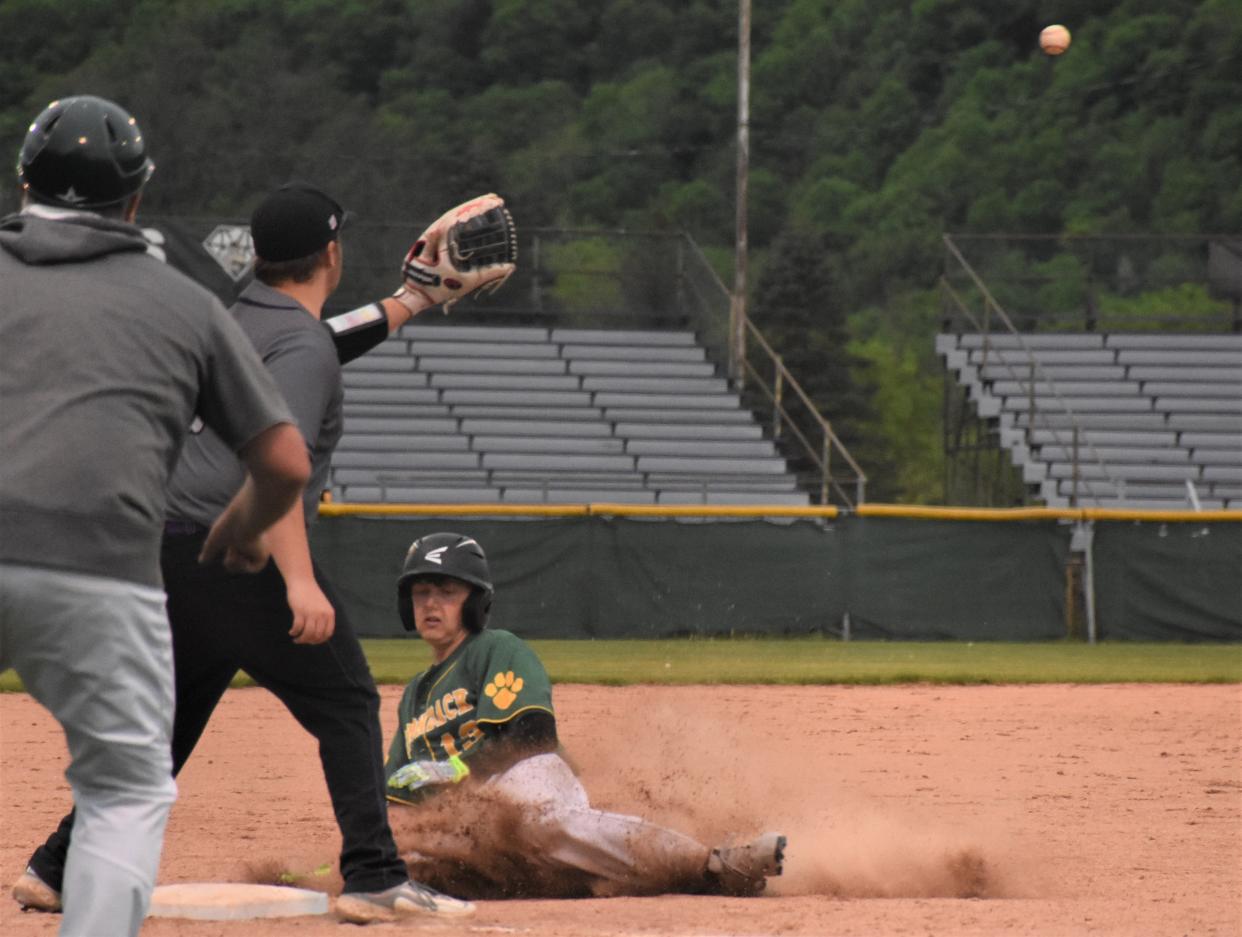 Adirondack Wildcat Tyler Ellinger slides safely into third base with a bases-loaded triple against Little Falls in the fifth inning of Monday's game at Veterans Memorial Park.