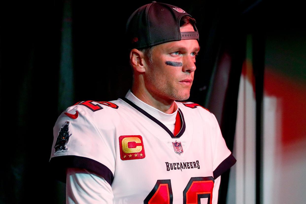 Tom Brady #12 of the Tampa Bay Buccaneers walks through the tunnel prior to an NFL wild card playoff football game against the Dallas Cowboys at Raymond James Stadium on January 16, 2023 in Tampa, Florida.