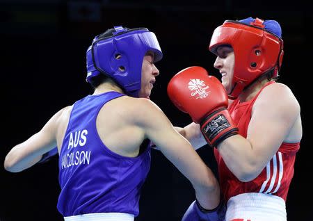 Boxing - Gold Coast 2018 Commonwealth Games - Women's 57kg Final Bout - Oxenford Studios - Gold Coast, Australia - April 14, 2018. Michaela Walsh of Northern Ireland in action with Skye Nicolson of Australia. REUTERS/Athit Perawongmetha