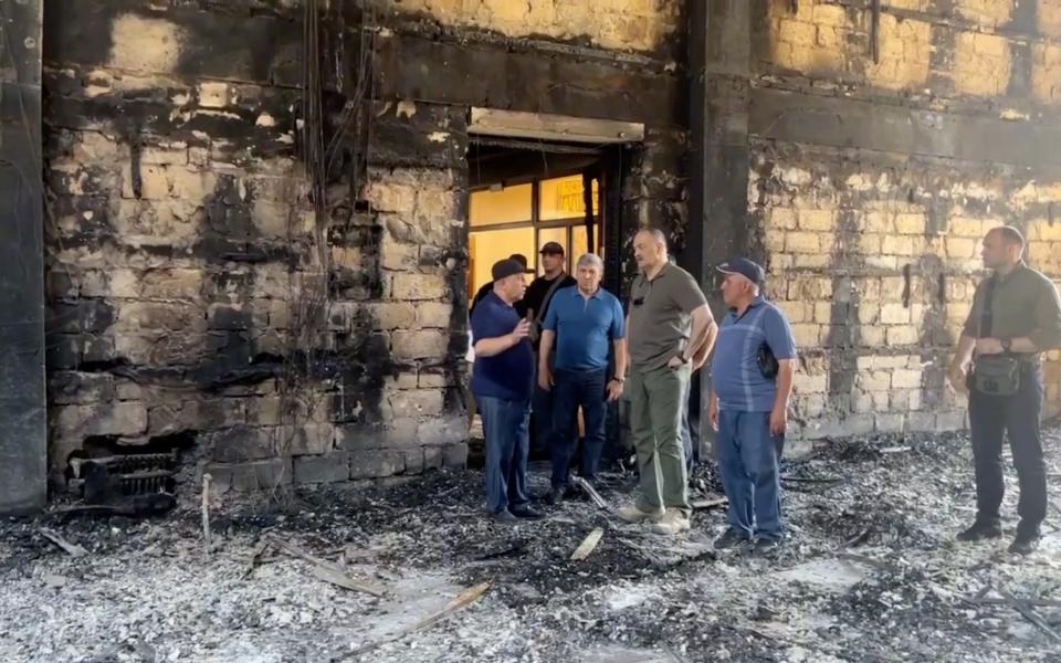 Sergei Melikov, the head of the Dagestan region, visits the Derbent synagogue following an attack by gunmen and a fire