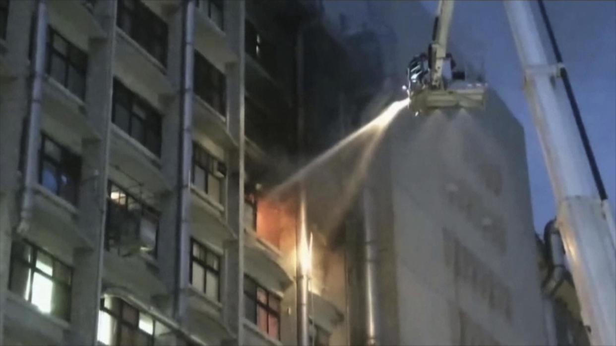 Firefighters try to extinguish the blaze at Taipei Hospital: EBC via AP