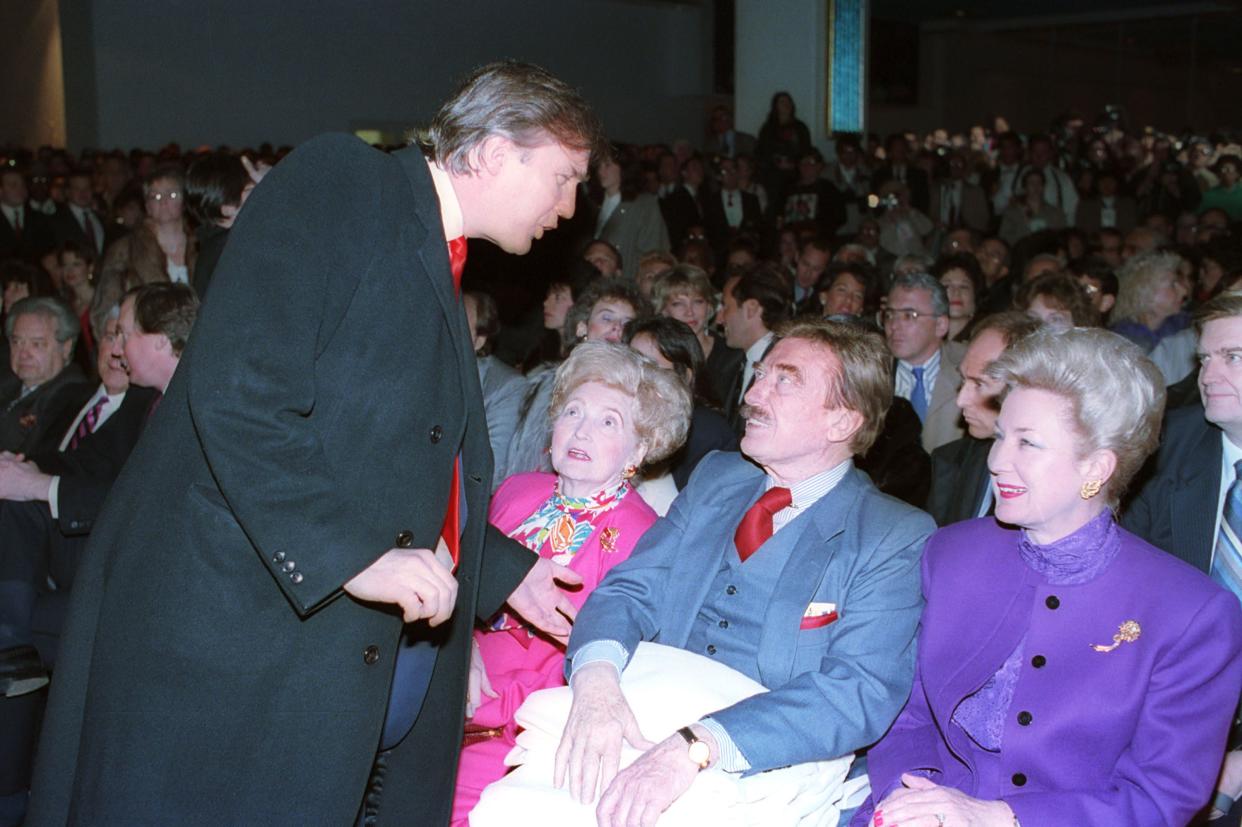 Donald Trump, left, talks with his parents, Mary and Fred and his sister, U.S. District Court Judge Maryanne Trump Barry, at the opening of Trump's Taj Mahal Casino Resort in Atlantic City, N.J., on April 5, 1990.