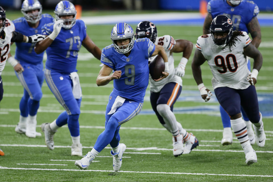 Detroit Lions quarterback Matthew Stafford (9) runs the ball against the Chicago Bears in the first half of an NFL football game in Detroit, Sunday, Sept. 13, 2020. (AP Photo/Duane Burleson)