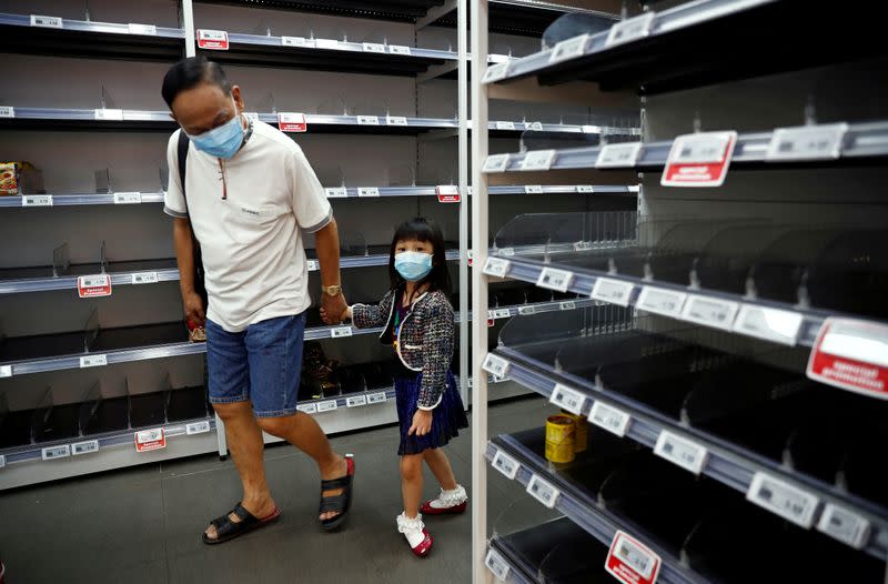 People stock up on food supplies after Singapore raised coronavirus outbreak alert level to orange