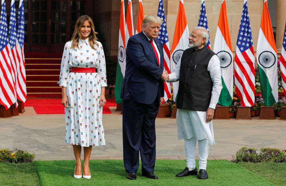 U.S. President Donald Trump shakes hands with India's Prime Minister Narendra Modi next to U.S. first lady Melania Trump ahead of their meeting at Hyderabad House in New Delhi, India, February 25, 2020. REUTERS/Adnan Abidi