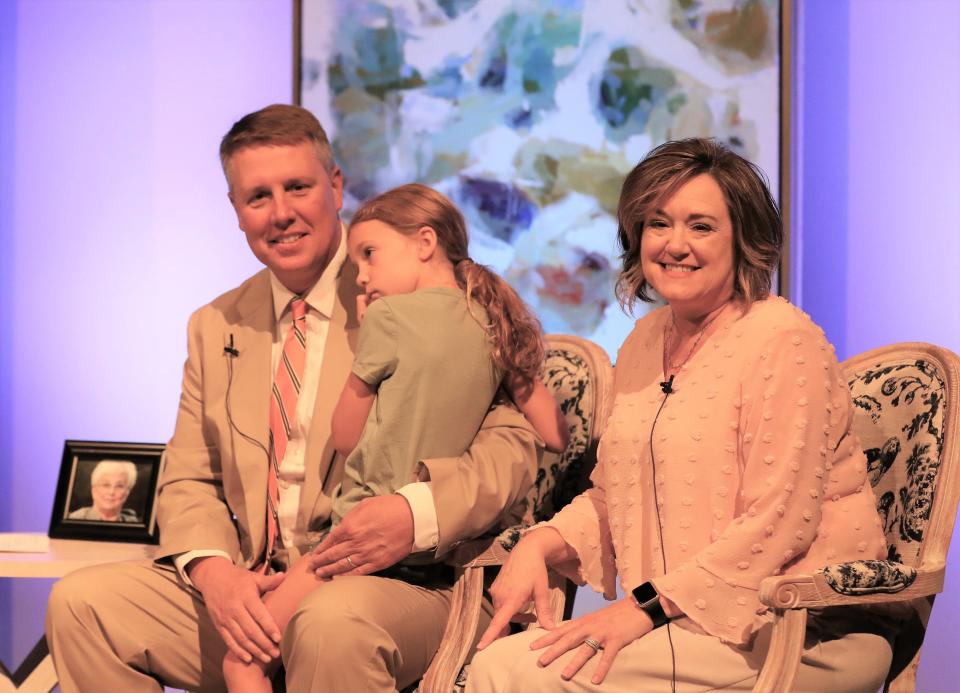 District Attorney General Jody Pickens, holding hiis daughter Elizabeth, and Lisa Schmidt, Director of the Madison County Child Advocacy Center, appeared on stage during the Circles of Hope Telethon held at the Carl Perkins Civic Center in Jackson on Sunday, August 21, 2022. The telethon raised more than $1.5 million for the Carl Perkins Centers for the Prevention of Child Abuse. Gail Bailey/The Jackson Sun