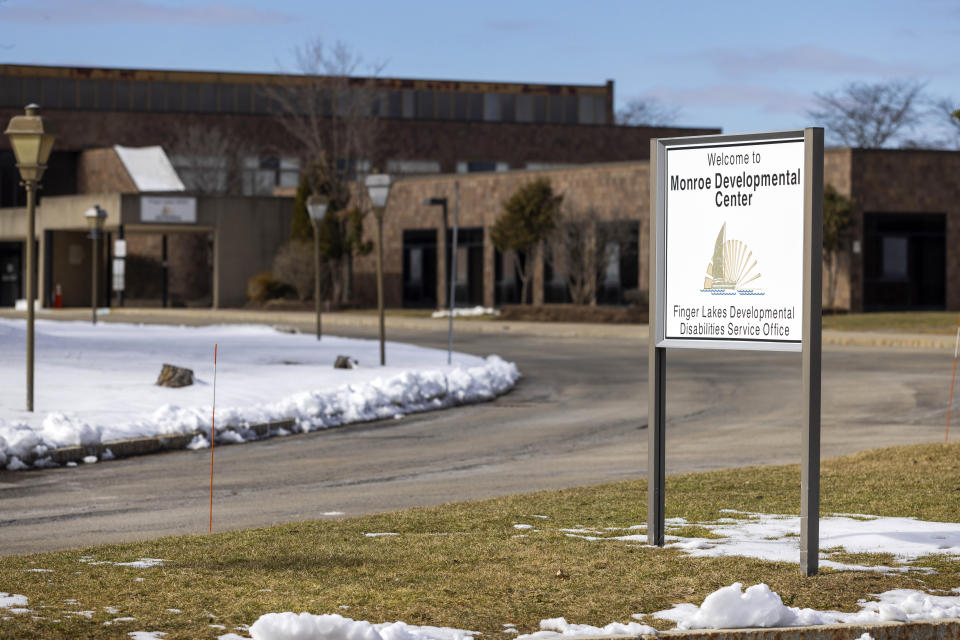 A sign for the Monroe Developmental Center at the Finger Lakes Developmental Disabilities Service Office on Wednesday, March 8, 2023, in Rochester, N.Y. A woman born to a severely disabled resident of the facility in 1986 has filed a lawsuit saying her mother was raped by an employee whose abuse was covered up by those in charge. (AP Photo/Lauren Petracca)