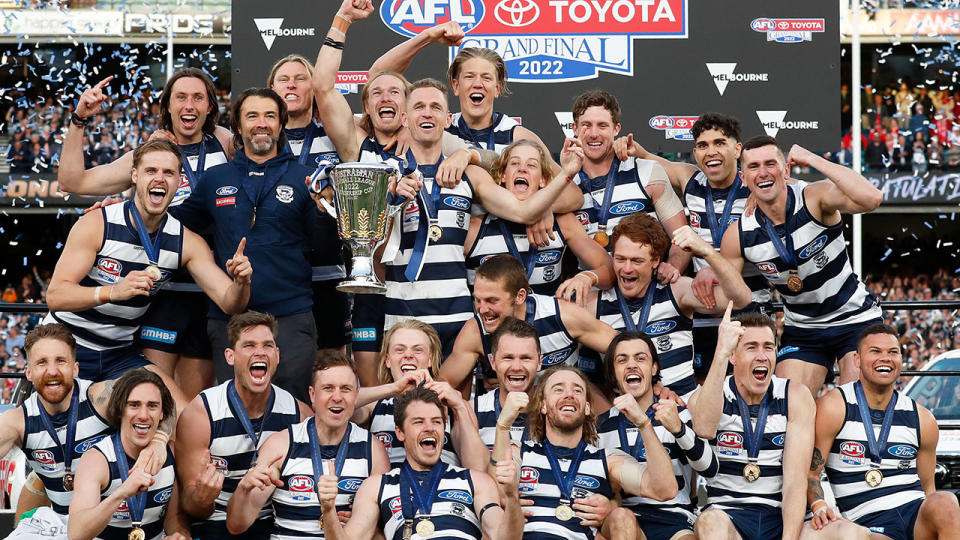 Seen here, Geelong players celebrate with the trophy after beating Sydney in the AFL grand final.