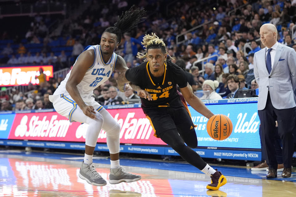 Arizona State guard Adam Miller (44) drives past UCLA guard Sebastian Mack (12) during the first half of an NCAA college basketball game Saturday, March 9, 2024, in Los Angeles. (AP Photo/Jae C. Hong)