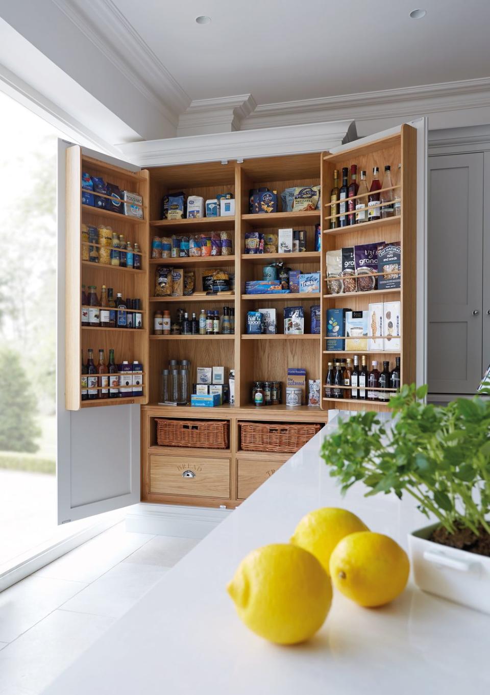 <p>In a soft oak, this kitchen larder unit brings in an element of warmth, while also providing plenty of storage. With more shelves than you can count, you'll never run out of space for all of those jars. <br></p><p>• See more from <a href="https://www.tomhowley.co.uk/" rel="nofollow noopener" target="_blank" data-ylk="slk:Tom Howley;elm:context_link;itc:0;sec:content-canvas" class="link ">Tom Howley</a> </p>