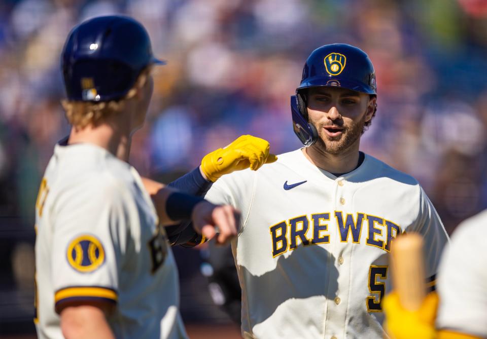 Milwaukee Brewers outfielder Garrett Mitchell celebrates with teammates after hitting a home run against the Los Angeles Dodgers during a spring training game Feb. 15 at American Family Fields of Phoenix.