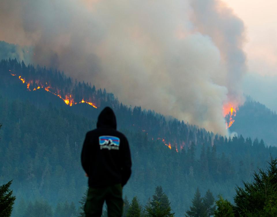 Firefighter Cole Campbell from Prineville prepares for another day on the fireline as the Lookout Fire burns above his camp at Tokatee Golf Course in McKenzie Bridge east of Springfield in August 2023.