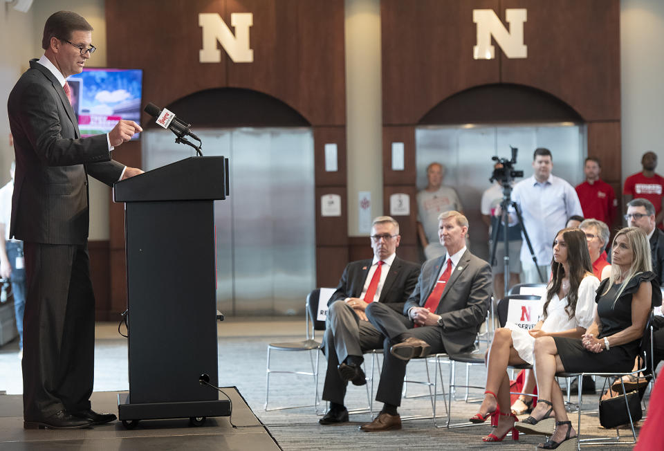 Trev Alberts speaks, as as his family, including wife Angie, right, and daughter Breanna, listen on after he was is introduced as Nebraska's new athletic director during a news conference, Wednesday, July 14, 2021, at Memorial Stadium in Lincoln, Neb. (Gwyneth Roberts/Lincoln Journal Star via AP)