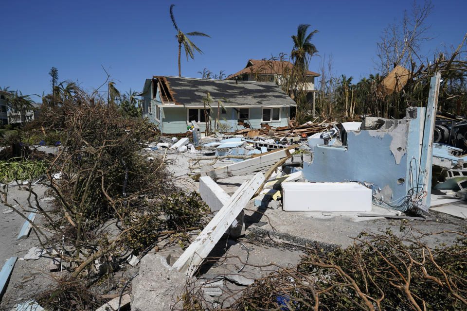 Damaged homes and debris is seen on Sanibel Island, in the aftermath of Hurricane Ian, Friday, Sept. 30, 2022, on Sanibel Island, Fla. (AP Photo/Steve Helber)
