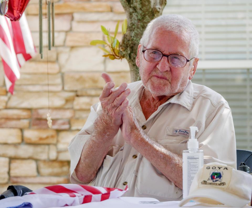 John Bellefontaine watches as people parade past his home in Leesburg on Sunday, Sept. 6, 2020. Bellefontaine is a 95-year-old World War II veteran who fought at the Battle of the Bulge.