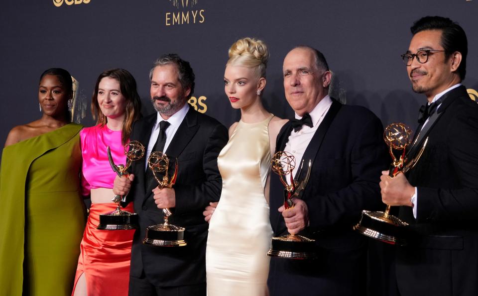 Moses Ingram (far left), Marielle Heller, Scott Frank, Anya Taylor-Joy, William Horberg and Mick Aniceto pose at the Emmy Awards after "The Queen's Gambit" won for best limited series.