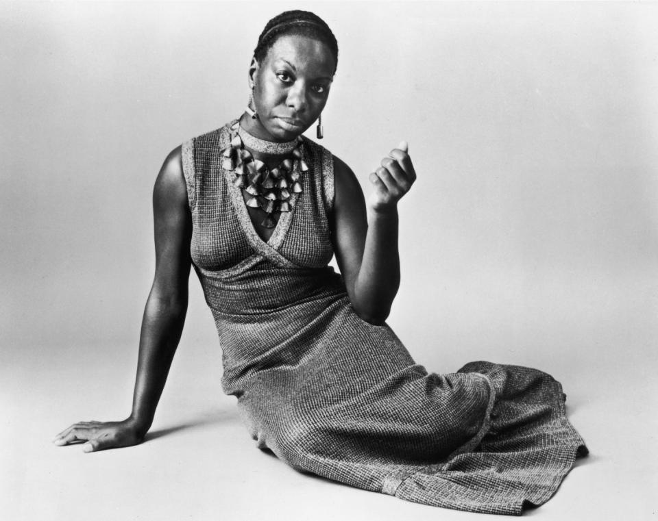 <p>Nina Simone put a spell on us with this easy knit dress and statement necklace. </p>