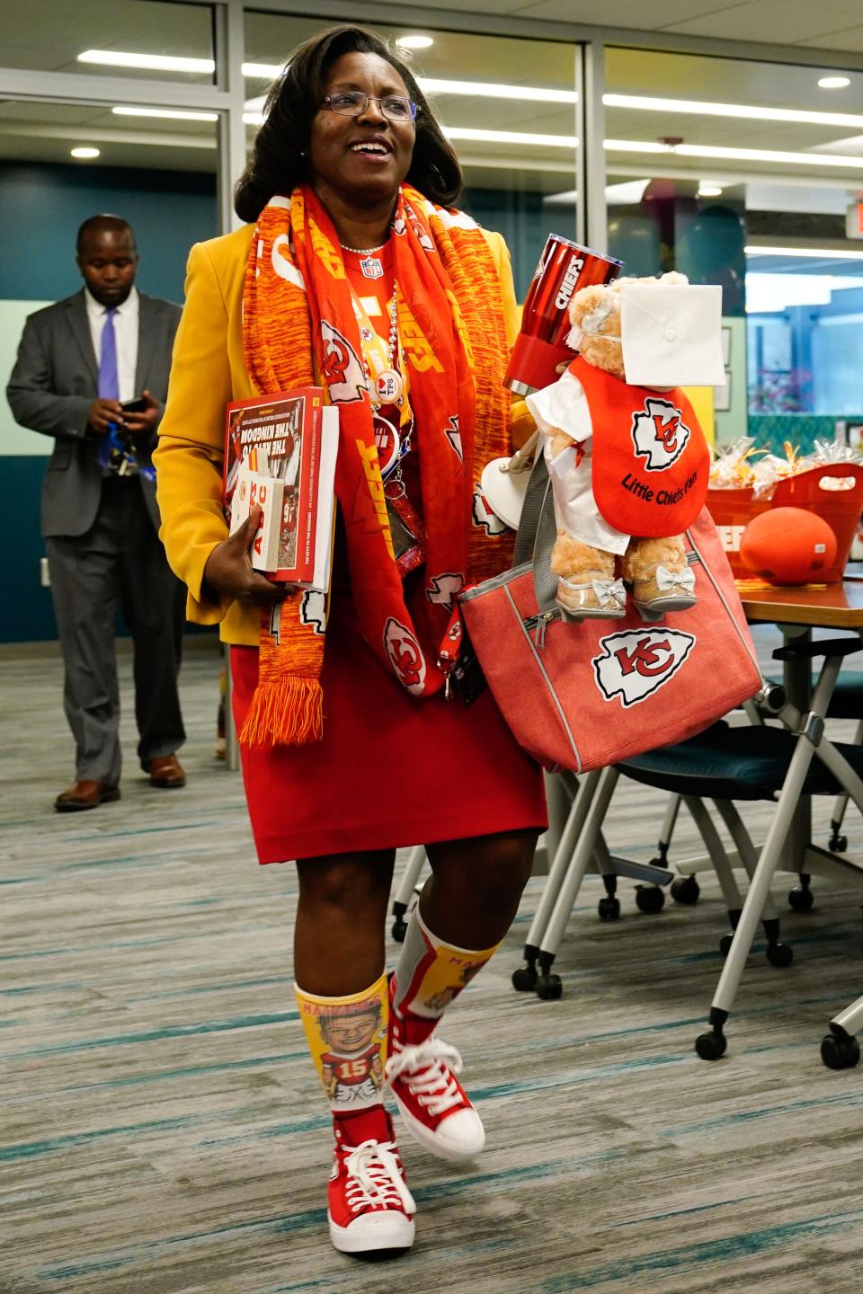 Sporting clothing that shows her Kansas City Chiefs' spirit from head to toe, Topeka USD 501 superintendent Tiffany Anderson walks Tuesday into the district's Bishop Educational Center.