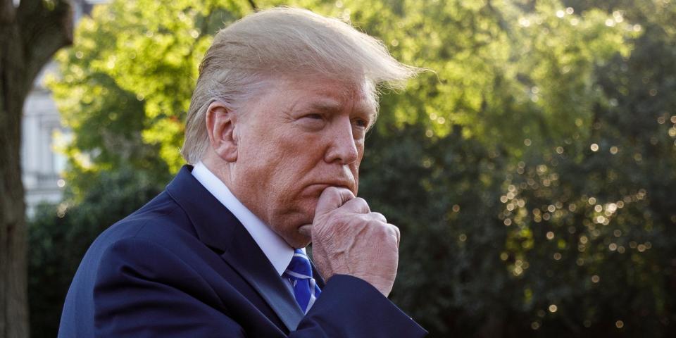 President Donald Trump pauses as he talks to media before boarding Maine One at the White House in Washington, Friday, Aug. 30, 2019