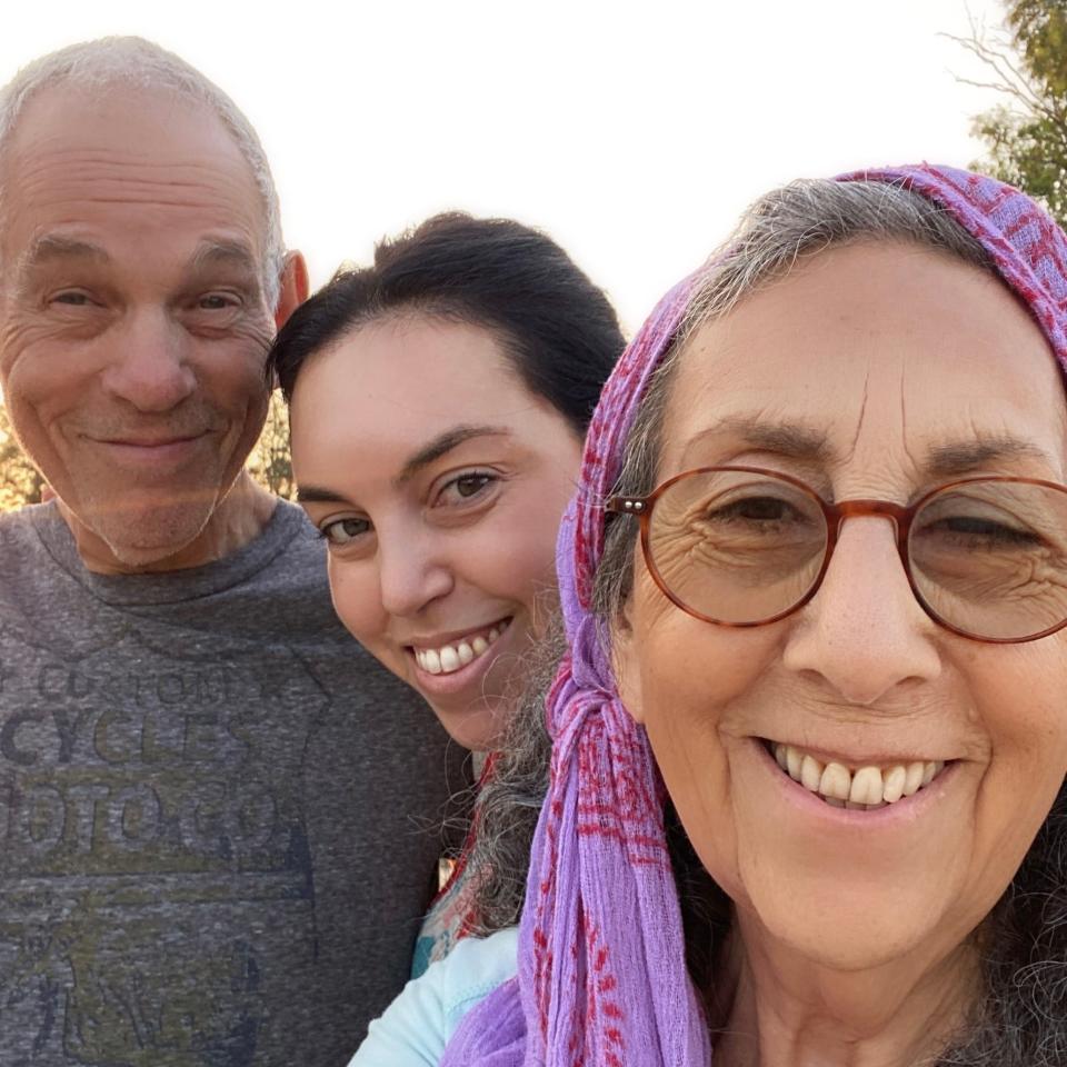 Iris Weinstein-Haggai with her parents, Judy Weinstein and Gad Haggai, on their morning walk in Israel's Kibbutz Nir Oz in an undated photo.
