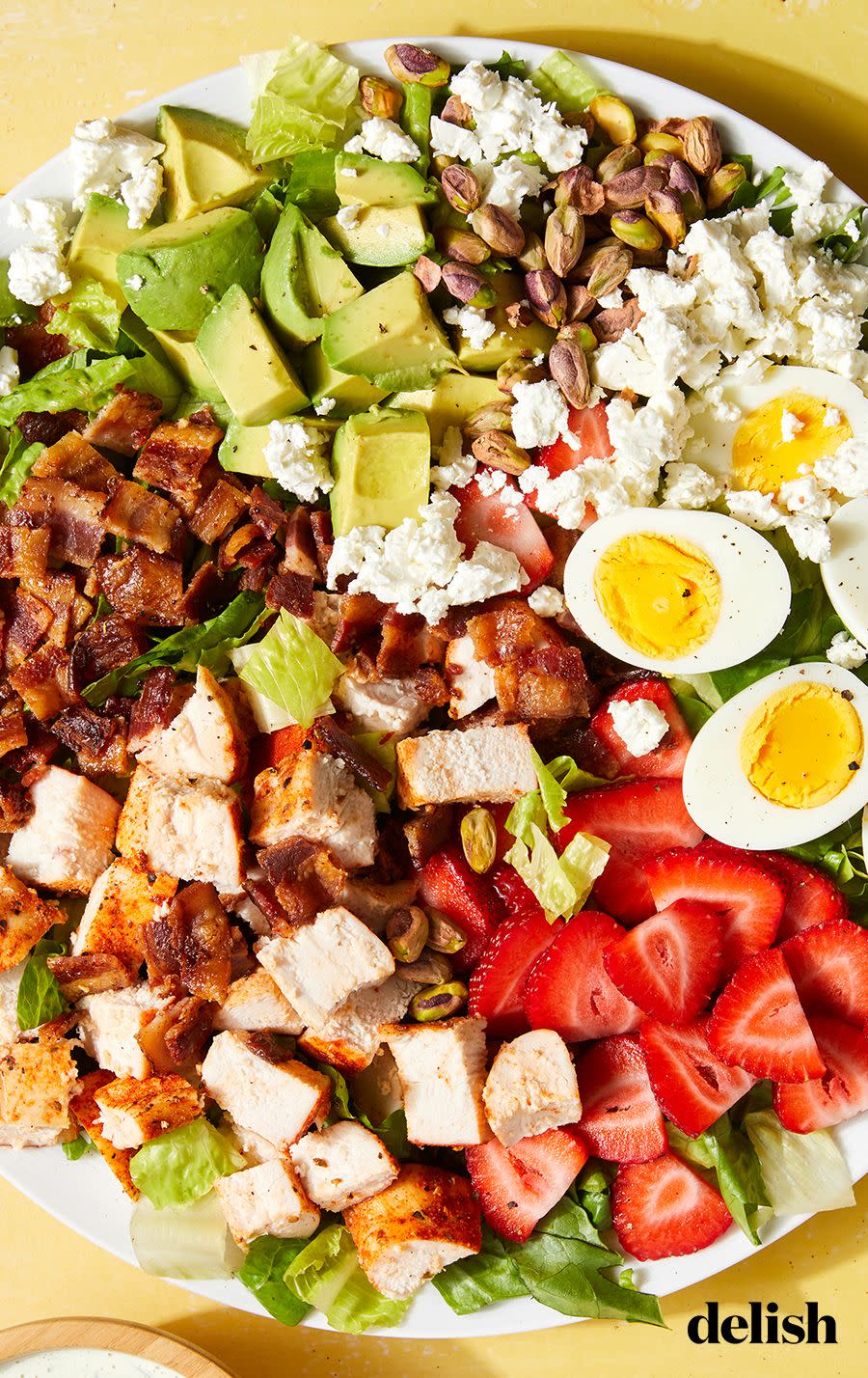 <p>There's a lot to love about a classic <a href="https://www.delish.com/cooking/recipe-ideas/recipes/a58703/best-cobb-salad-recipe/" rel="nofollow noopener" target="_blank" data-ylk="slk:Cobb salad;elm:context_link;itc:0;sec:content-canvas" class="link ">Cobb salad</a>. It's packed with hard-boiled eggs, chopped chicken, <a href="https://www.delish.com/cooking/a22502749/how-to-cook-bacon-in-the-oven-recipe/" rel="nofollow noopener" target="_blank" data-ylk="slk:bacon;elm:context_link;itc:0;sec:content-canvas" class="link ">bacon</a>, avocado, and refreshingly crispy romaine. The gang's all here, except with some big-time upgrades. Strawberries stand in for the standard tomatoes, while feta takes the place of blue cheese. Fear not, there's still an extra-creamy buttermilk-based dressing that coats every bite.</p><p>Get the <strong><a href="https://www.delish.com/cooking/recipe-ideas/a40444370/strawberry-chicken-cobb-salad-recipe/" rel="nofollow noopener" target="_blank" data-ylk="slk:Strawberry Chicken Cobb Salad recipe;elm:context_link;itc:0;sec:content-canvas" class="link ">Strawberry Chicken Cobb Salad recipe</a></strong>.</p>