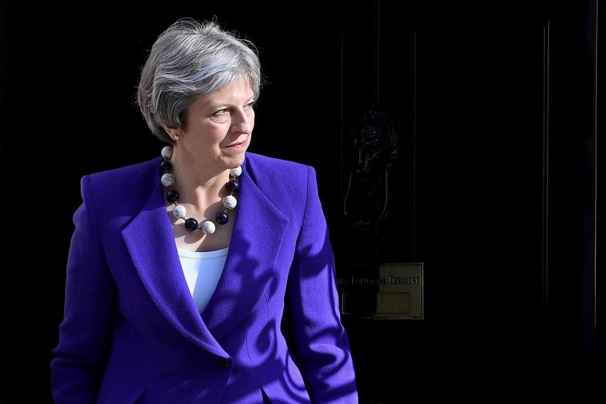 Threat: The DUP have threatened to 'bring down' Theresa May: EPA