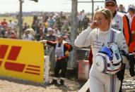 File photo of Williams Formula One driver Susie Wolff of Britain after her car broke down during first practice ahead of the British Grand Prix at the Silverstone Race Circuit, central England, July 4, 2014. REUTERS/Phil Noble