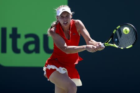 Mar 30, 2017; Miami, FL, USA; Caroline Wozniacki of Denmark hits a backhand against Karoilina Pliskova of the Czech Republic (not pictured) in a women's singles semi-final during the 2017 Miami Open at Crandon Park Tennis Center. Geoff Burke-USA TODAY Sports