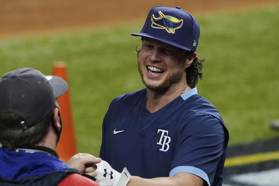 Tampa Bay Rays right fielder Brett Phillips arrives for batting practice before Game 5 of the baseball World Series against the Los Angeles Dodgers Sunday, Oct. 25, 2020, in Arlington, Texas. (AP Photo/Tony Gutierrez)