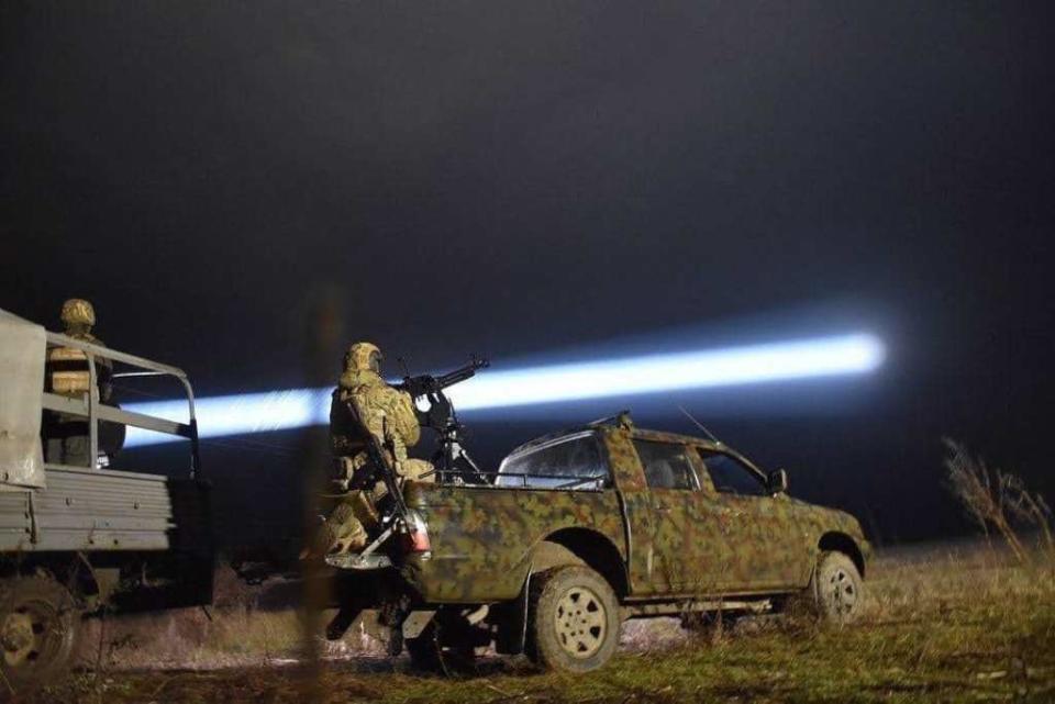 A Ukrainian counter-drone fire team uses a searchlight to hunt for Russian drones. <em>Ukrainian government</em>