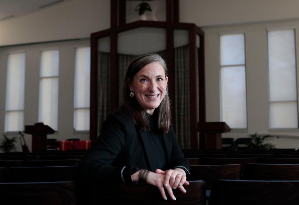 Rabbi Sharon Mars poses in the sanctuary during the grand opening of Temple Israel on the last day of Hanukkah on Sunday. "Everything about this place is intentional, that's what makes it so special," said Rabbi Mars. "Hopefully, this is a home for many people not just for our folks who call Temple Israel home."