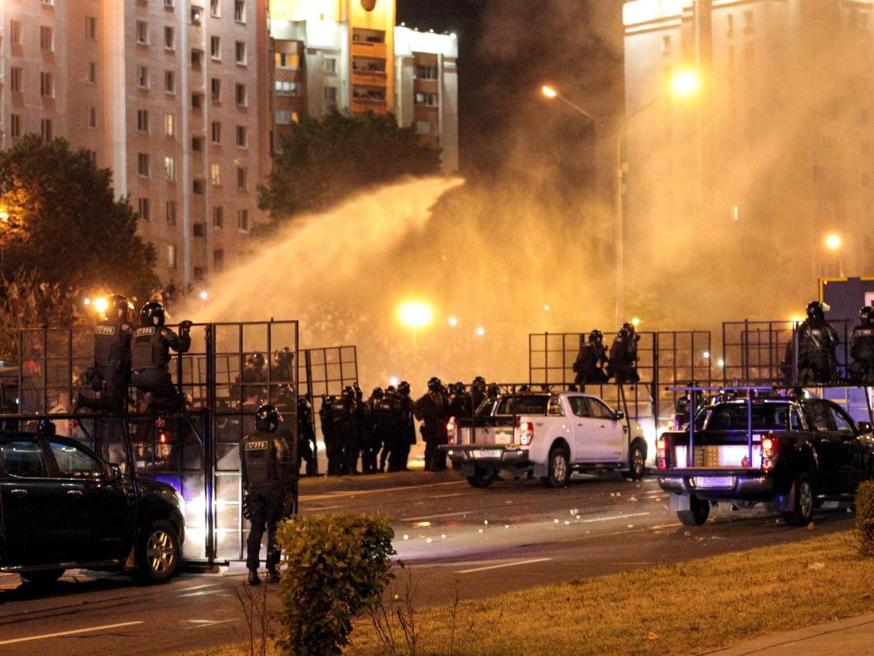 Riot police use a water cannon against protesters after polls closed in Belarus' presidential election, in Minsk: AFP via Getty Images