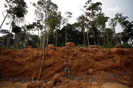 Indigenous man reacts in front of a deforested area in unmarked indigenous lands inside the Amazon rainforest near Humaita