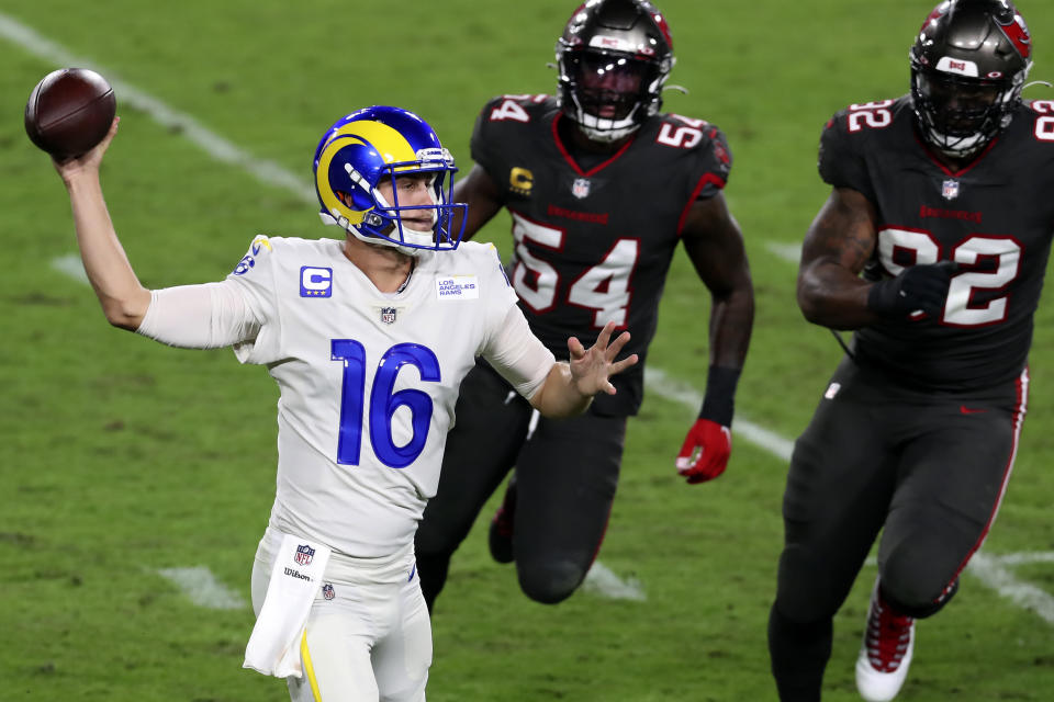 Los Angeles Rams quarterback Jared Goff (16) throws a pass as he is pressured by Tampa Bay Buccaneers inside linebacker Lavonte David (54) and defensive end William Gholston (92) during the first half of an NFL football game Monday, Nov. 23, 2020, in Tampa, Fla. (AP Photo/Mark LoMoglio)