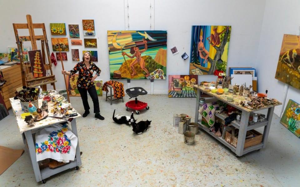 A 2021 photo of artist Judith Linhares in her studio. An exhibition of her work and others she chose is featured at the Sarasota Art Museum.
