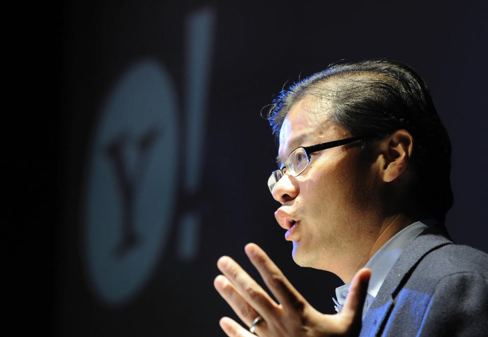 Yang, CEO and co-founder of Yahoo!, gestures as he addresses a conference in central London.