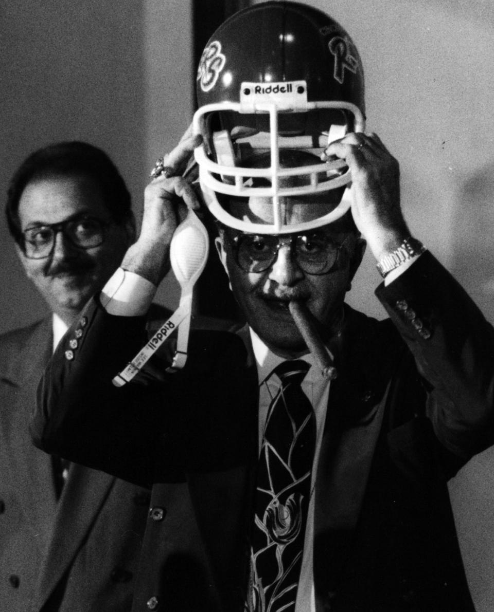 Tom Gregory, left, runs the Montgomery Inn but was part of the ownership team of Cincinnati's first indoor football team, the Rockers.