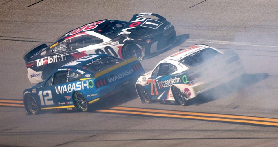 TALLADEGA, ALABAMA - APRIL 21: Christopher Bell, driver of the #20 Mobil 1 Toyota, as Ryan Blaney, driver of the #12 Wabash Ford, and Zane Smith, driver of the #71 Focused Health Chevrolet, pass during the NASCAR Cup Series GEICO 500 at Talladega Superspeedway on April 21, 2024 in Talladega, Alabama. (Photo by James Gilbert/Getty Images)