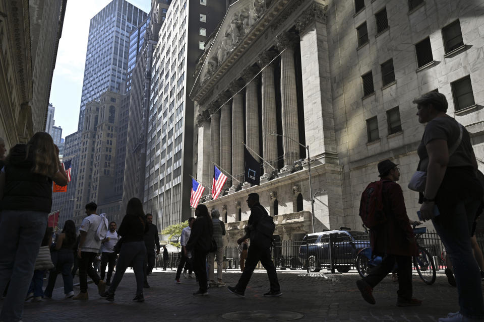 FTSE Photo by: NDZ/STAR MAX/IPx 2023 10/26/23 People walk past the New York Stock Exchange (NYSE) on Wall Street on October 26, 2023 in New York City.