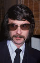 Headshot of American music producer Phil Spector wearing sunglasses indoors, 1980. (Photo by Frank Edwards/Fotos International/Getty Images)