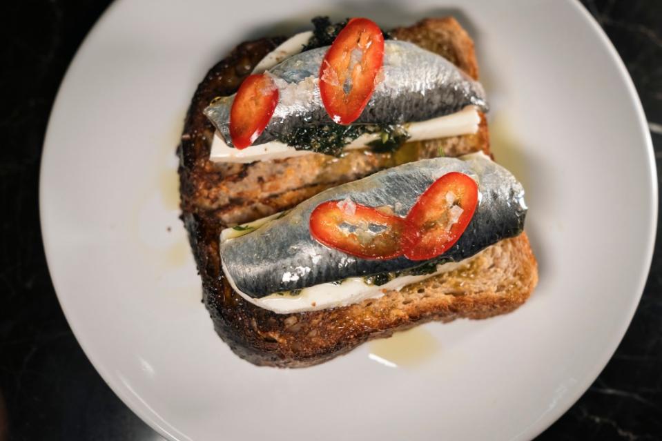 Toast alla veloce, with fresh sardines, caper-mint salsa, mozzarella, fresno and polenta bread ($16). Stefano Giovannini