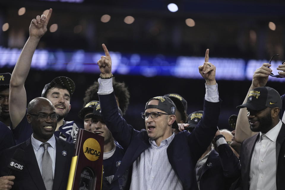 Connecticut head coach Dan Hurley celebrates with his players after the men's national championship college basketball game against San Diego State in the NCAA Tournament on Monday, April 3, 2023, in Houston. (AP Photo/Brynn Anderson)