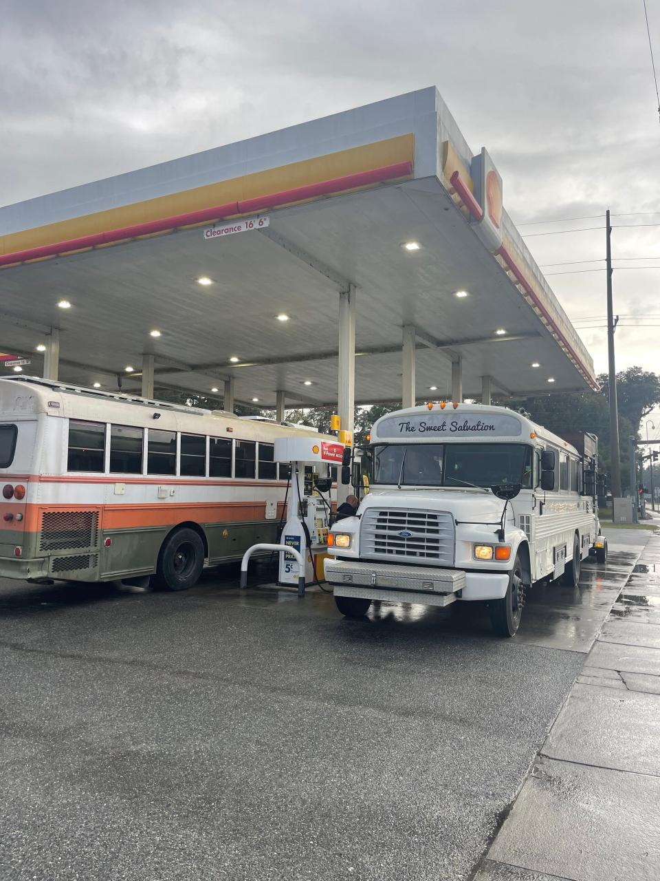 school bus getting gas at gas station