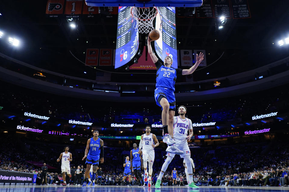 Orlando Magic's Franz Wagner (22) goes up for a dunk during the first half of an NBA basketball game against the Philadelphia 76ers, Wednesday, Jan. 19, 2022, in Philadelphia. (AP Photo/Matt Slocum)