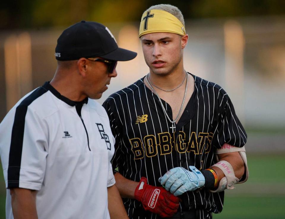 Benbrook catcher Giuliano Martinez talks with head coach Justin Chavez during a UIL District 4A Region 2 Quarterfinals at Coppell Baseball Complex in Coppell, Texas, Friday, May 17, 2024.