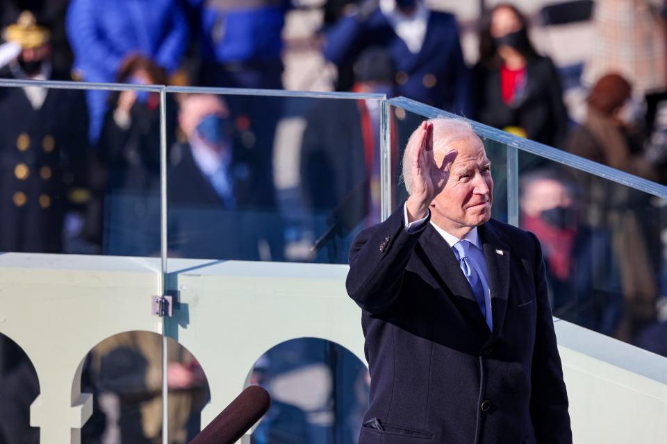 President Joe Biden waves as he prepares to deliver his inaugural address.