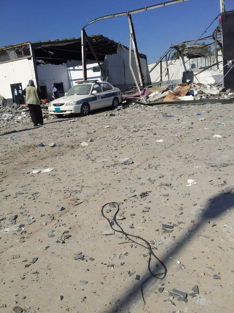 This image taken on a mobile phone on Wednesday July 3, 2019 shows the damage inside the detention center in Tripoli's Tajoura neighborhood after an airstrike. Libyan officials say an airstrike has struck a detention center for migrants in the capital, killing at least 40 people and wounding dozens. The airstrike was likely to raise further concerns about the European Union's policy of partnering with Libyan militias to prevent migrants from crossing the Mediterranean, which often leaves them at the mercy of brutal traffickers or stranded in squalid detention centers near the front lines. (AP Photo)