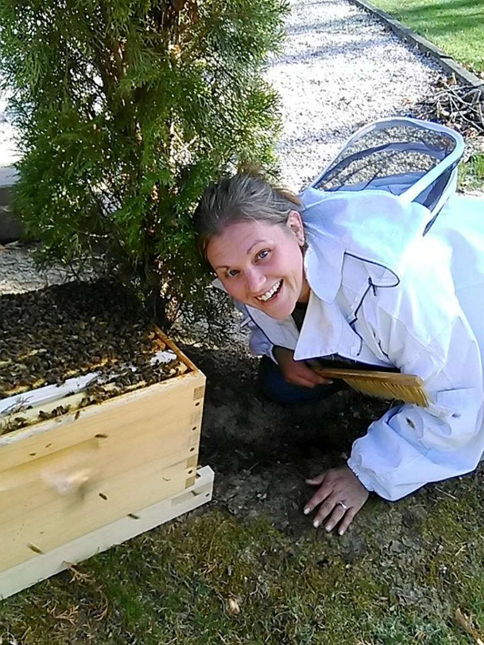 Mueller in her beekeeping suit